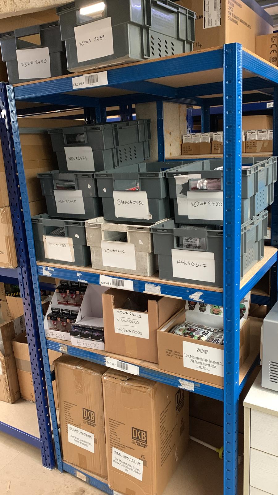 Labelled stock bins on shelving at the OFEX warehouse
