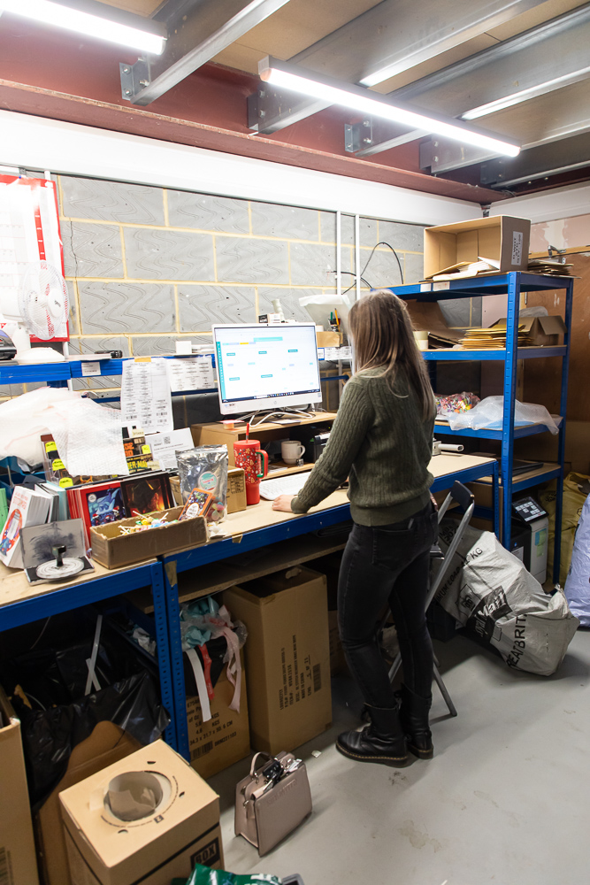OFEX team member working at a packing station